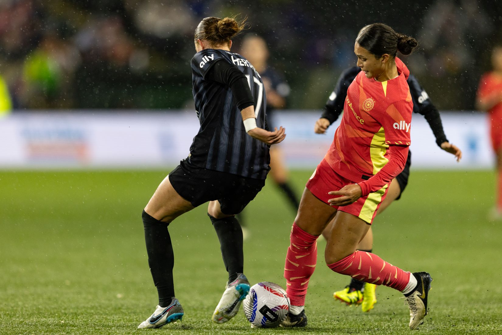 Sophia Smith cuts the ball across her body to beat a Washington Spirit defender.